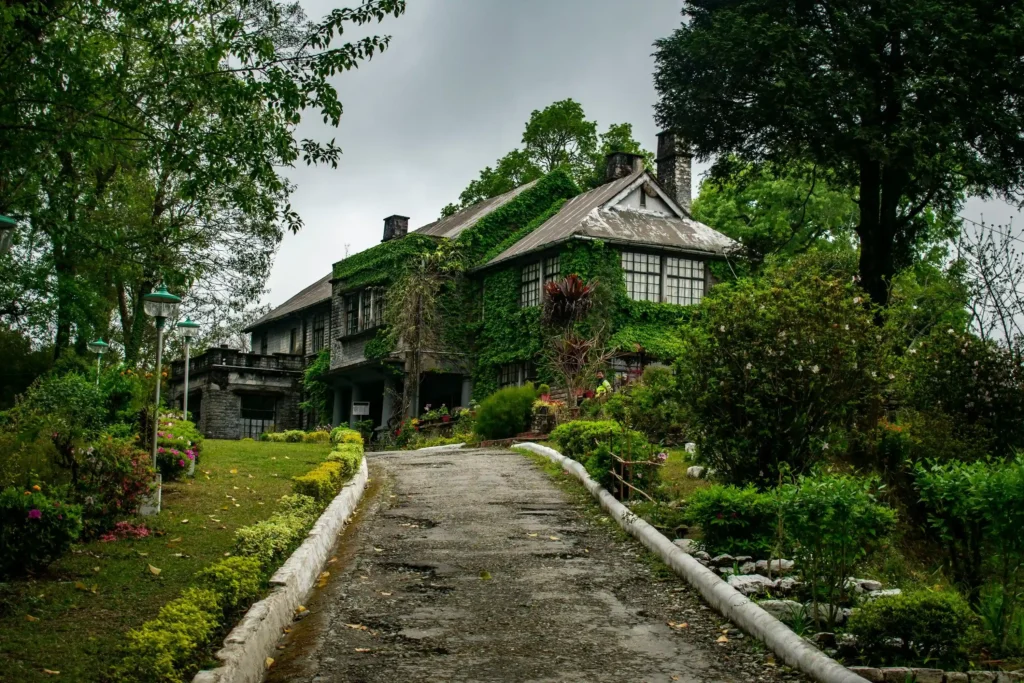 Explore the Morgan House heritage building surrounded by trees in Kalimpong with our Kalimpong Tour Package